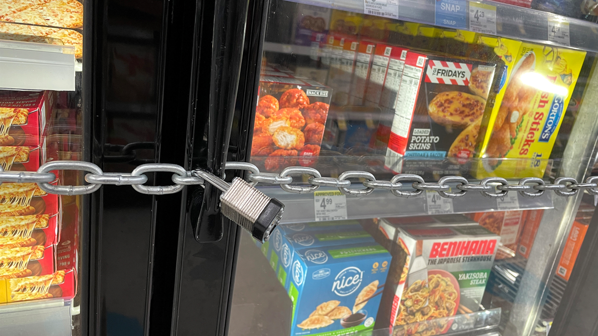 SAN FRANCISCO, CALIFORNIA - JULY 18: A chain with padlocks secures freezer doors at a Walgreens store on July 18, 2023 in San Francisco, California. A San Francisco Walgreens store has locked its freezers with chains and padlocks to thwart shoplifters that have been hitting the store on a regular basis and stealing frozen pizzas and ice cream.