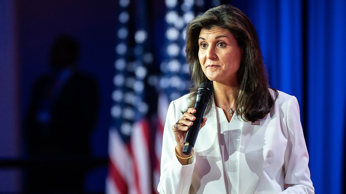 Nikki Haley holding microphone at event