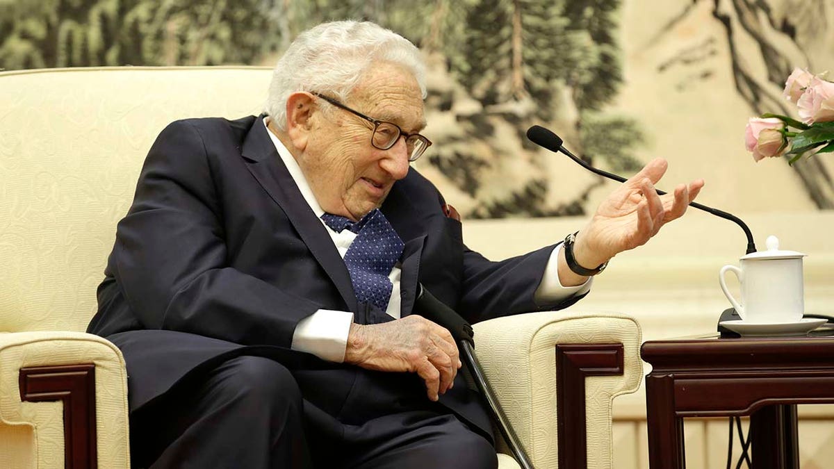 Henry Kissinger speaks during a meeting with Chinese Foreign Minister Wang Yi