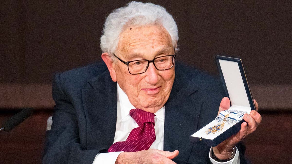 Henry Kissinger seen in a suit