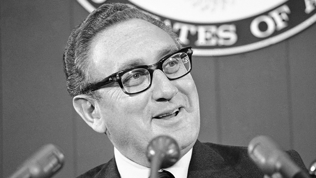Henry Kissinger speaking to press