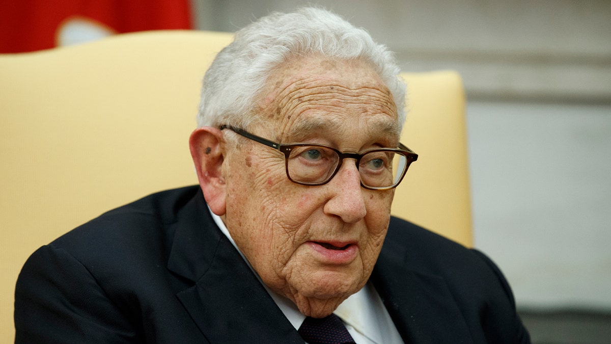 Henry Kissinger in chair