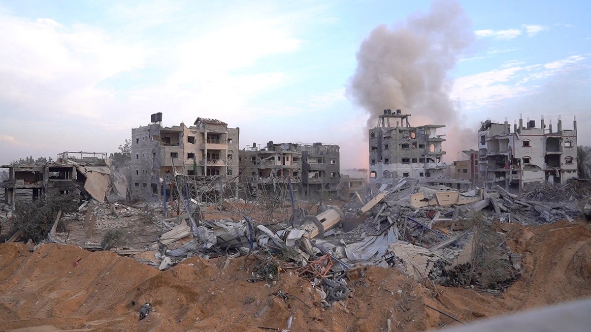 smoking building, rubble in Gaza