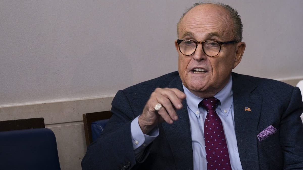 Rudy Giuliani in suit speaking