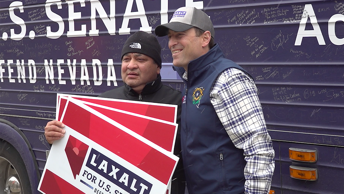 Adam Laxalt poses with supporter