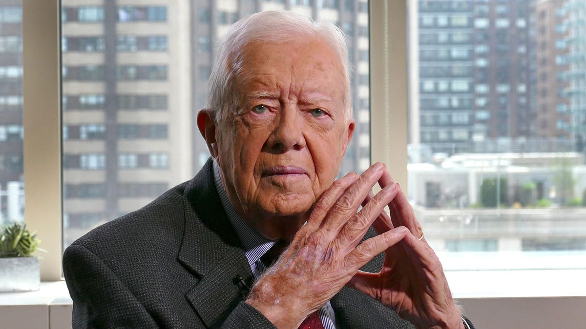 Jimmy Carter, hands clasped
