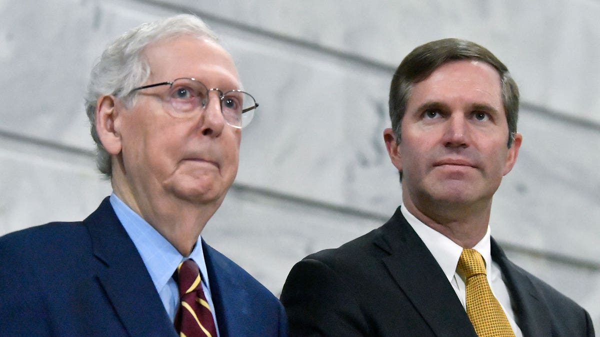 Senate Minority Leader Mitch McConnell speaks with Kentucky Gov. Andy Beshear