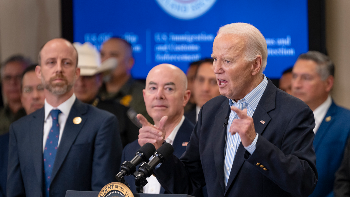 President Biden at podium with hands pointing