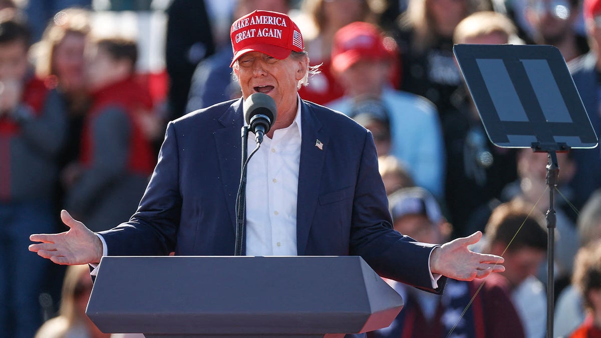 Donald Trump at Ohio rally wearing red MAGA cap