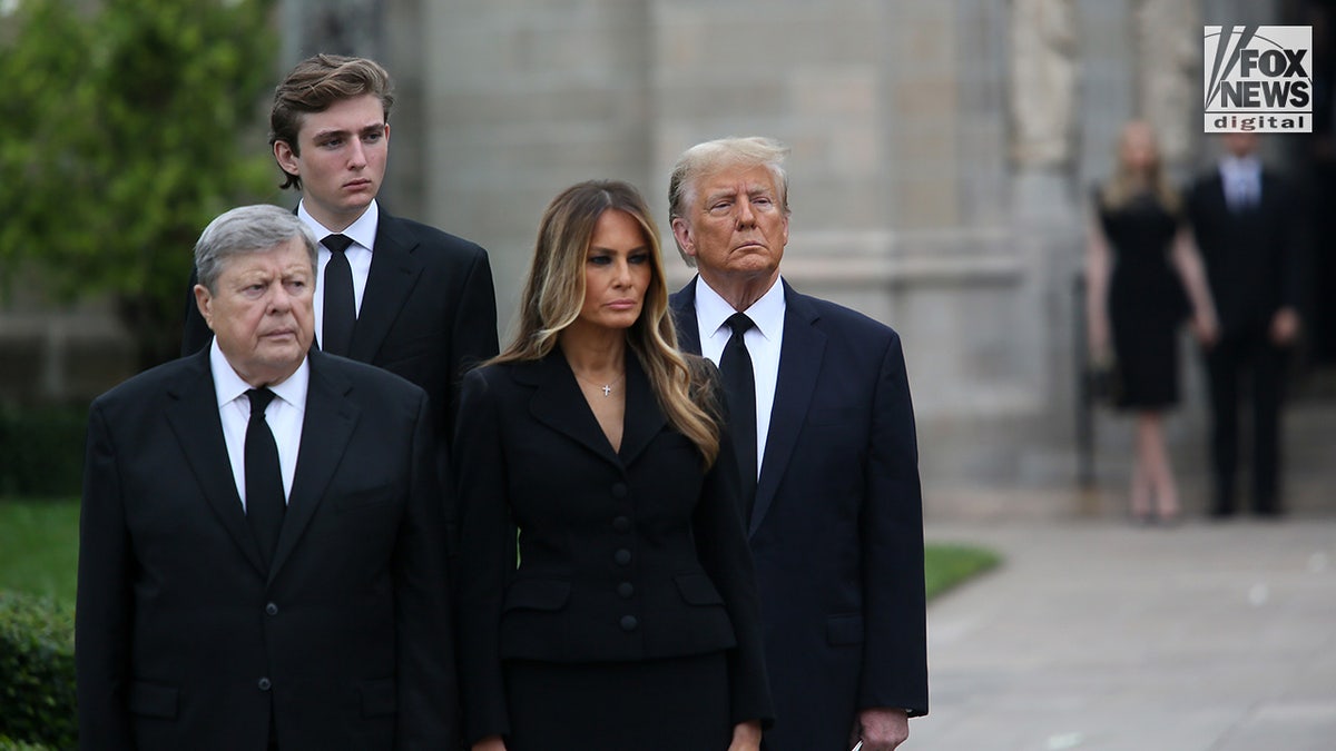 Barron Trump, second from left, with President Trump and Melania Trump attending funeral