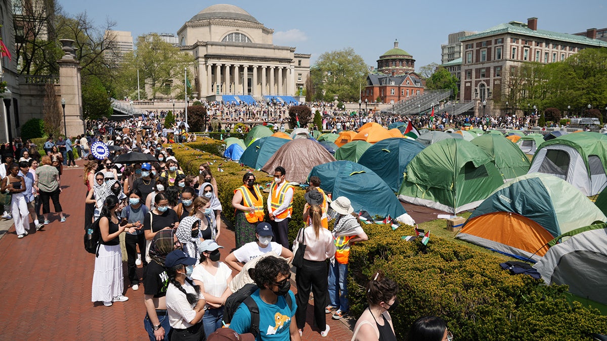 Students march on Columbia University campus in support of a protest encampment supporting Palestinians