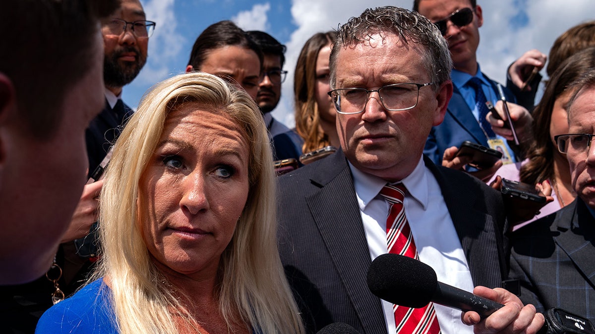 Reps. Marjorie Taylor Greene and Thomas Massie