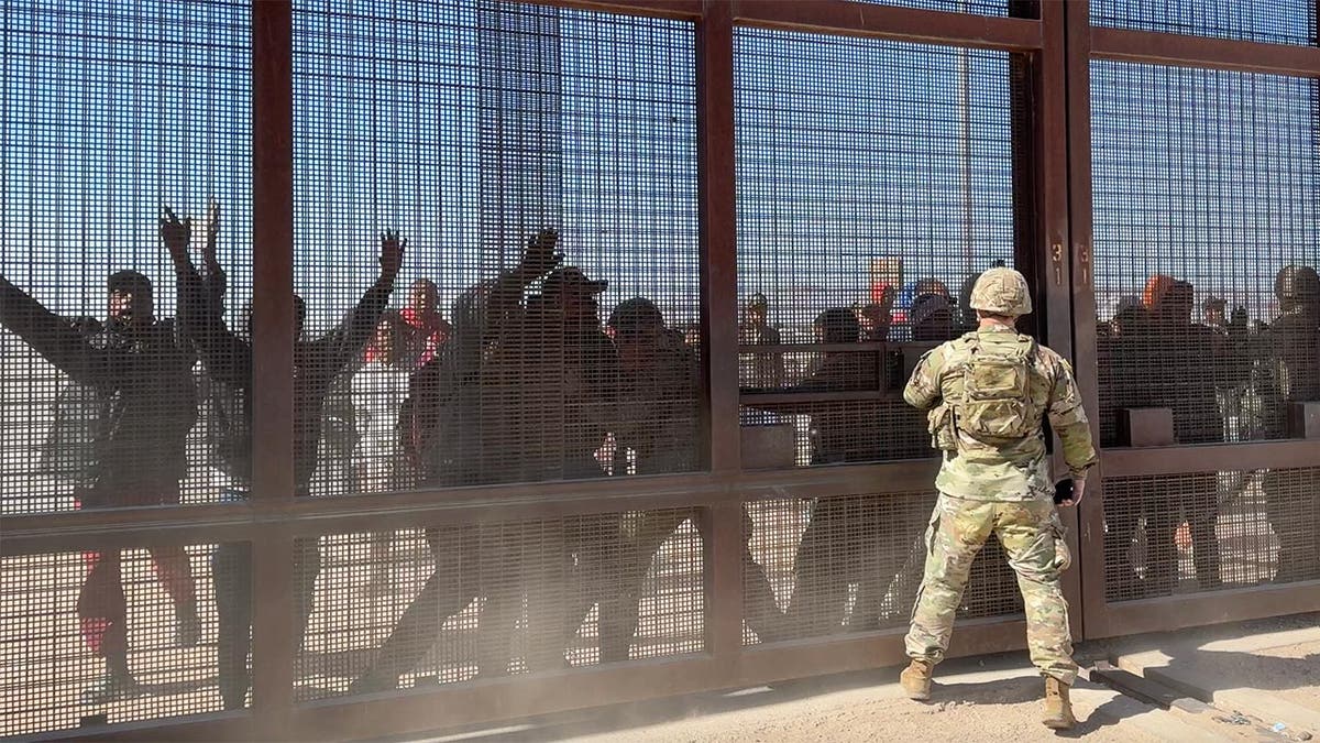 Migrants storm the gate at the border in El Paso