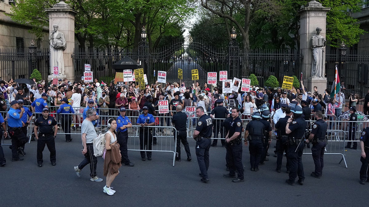 Demonstrators gather outside an entrance to Columbia University as students rally on the campus at a protest encampment in support of Palestinians