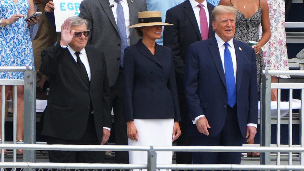 Donald Trump, Melania Trump and Viktor Knavs in the stands