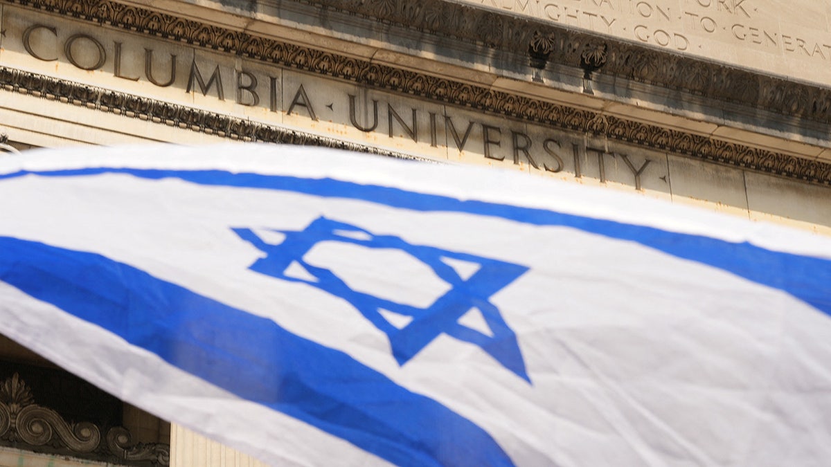 israeli flag waves in front of Columbia University building