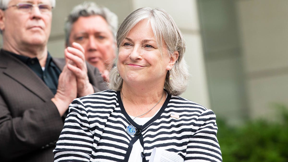 Rep. Susan Wild with people behind her outside