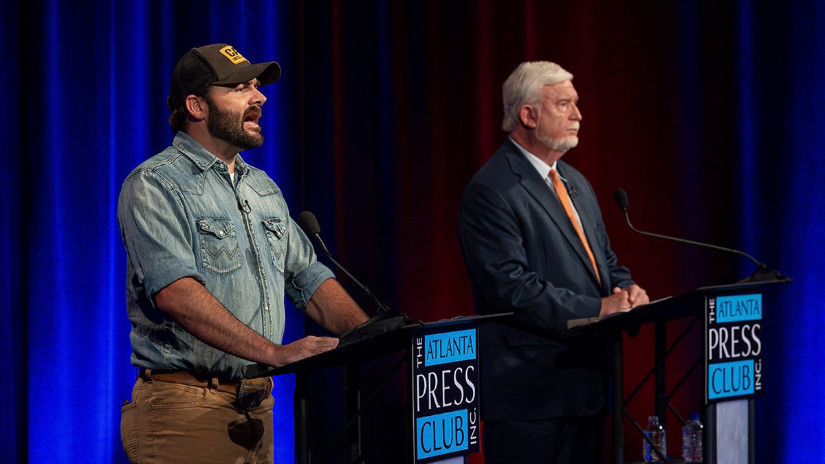 Hand and Johnson on debate stage