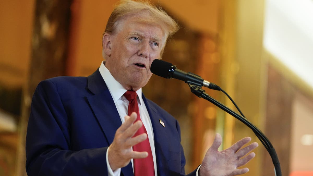 Donald Trump speaking at lectern