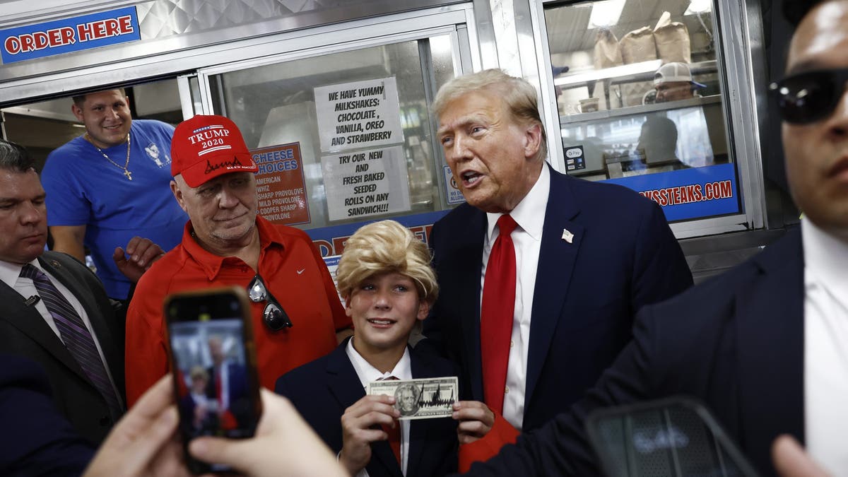 Trump meets young fan dressed as him