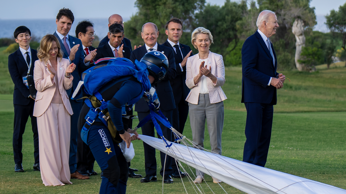 Biden looks off into distance while with G7 leaders