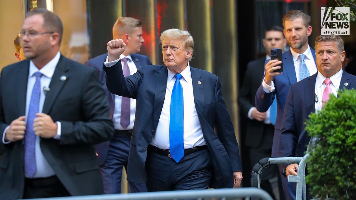 Donald Trump arriving at Trump Tower pumping fist