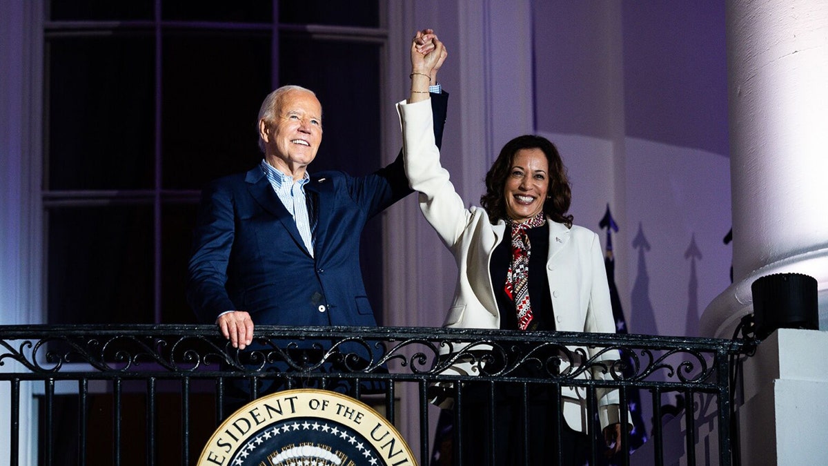 Joe Biden raising Kamala's arm on Truman Balcony