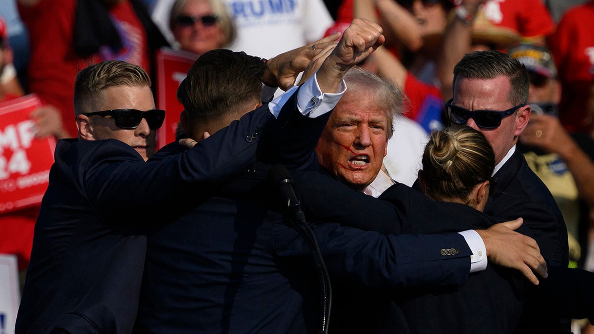 Trump pumps fist at Pennsylvania rally shooting