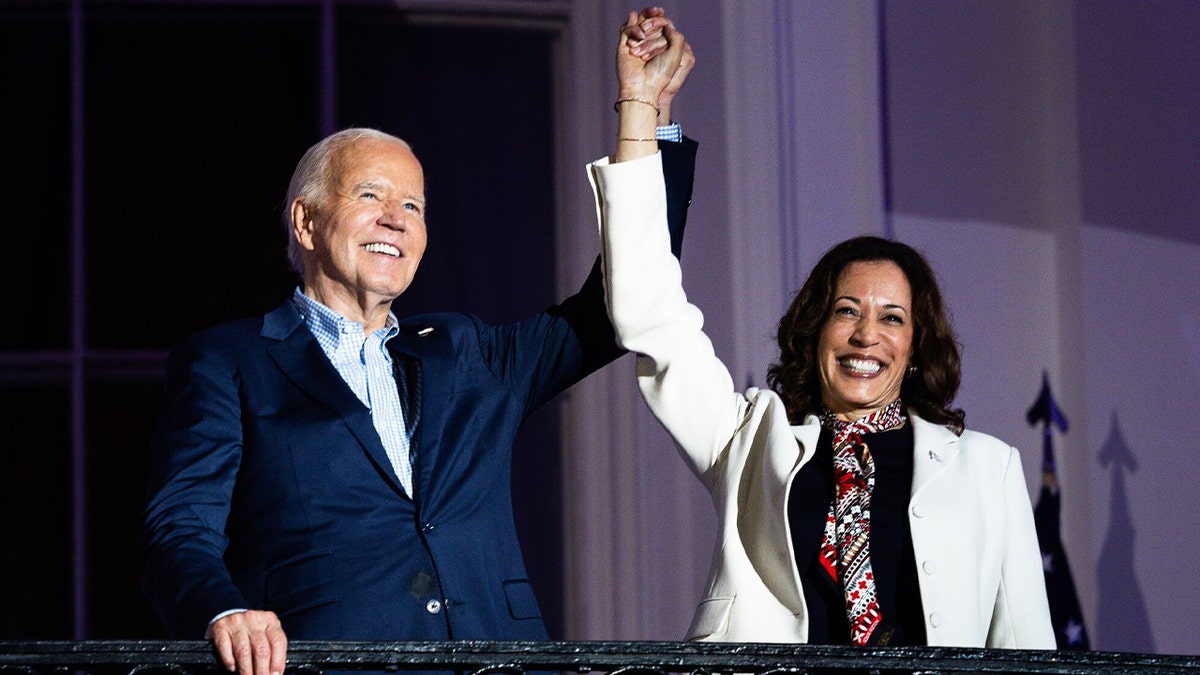 Biden and Kamala holding up hands in victory