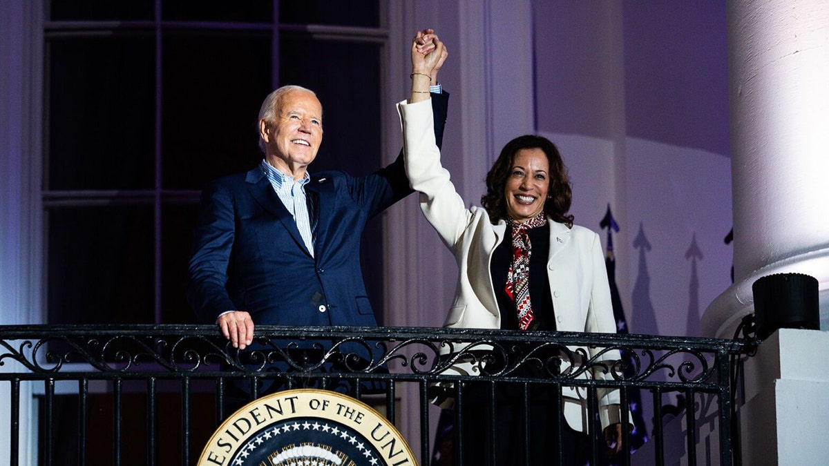 Joe Biden, Kamala Harris raising arms on Truman Balcony