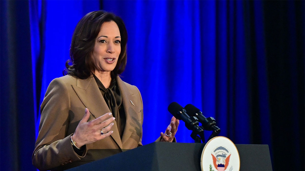 Kamala Harris speaking at lectern