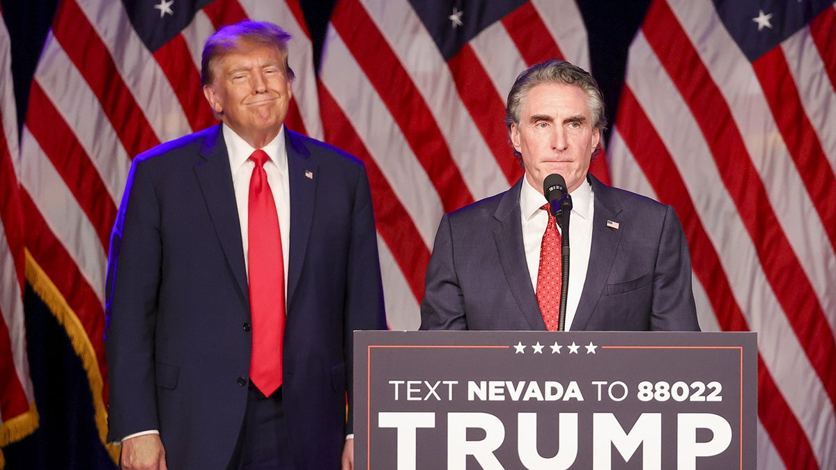 Donald Trump, Doug Burgum on stage