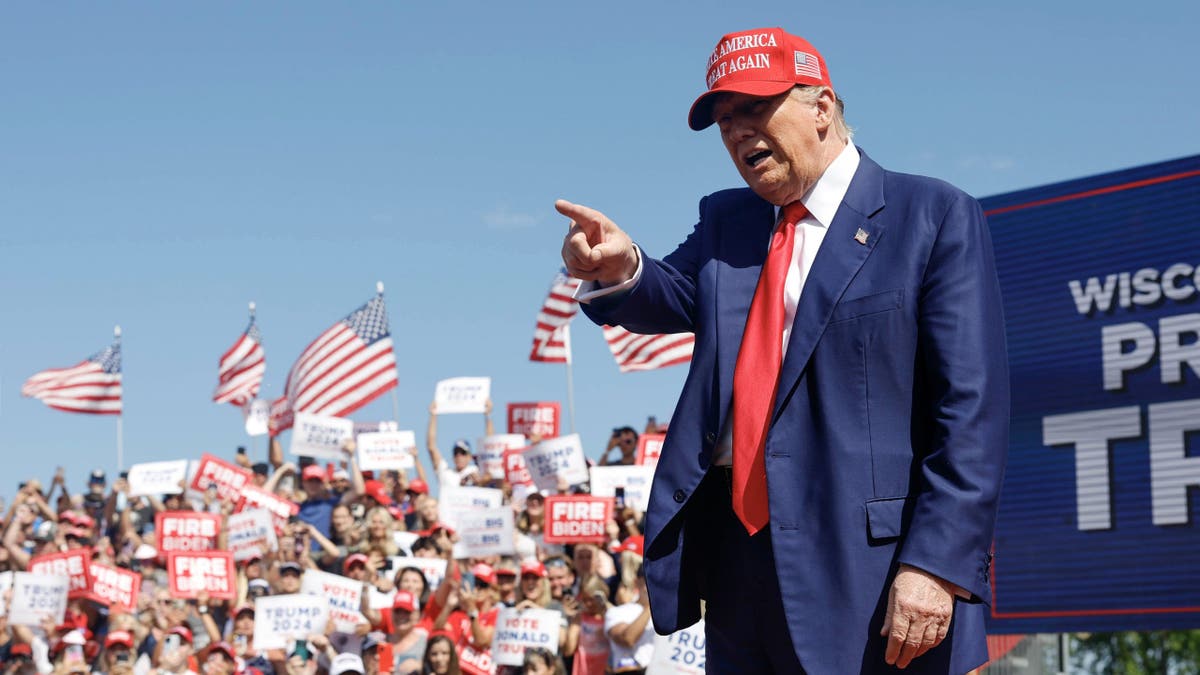 Republican presumptive presidential candidate and former President Donald Trump walks to the podium at a campaign event Tuesday, June 18, 2024, in Racine, Wisconsin.