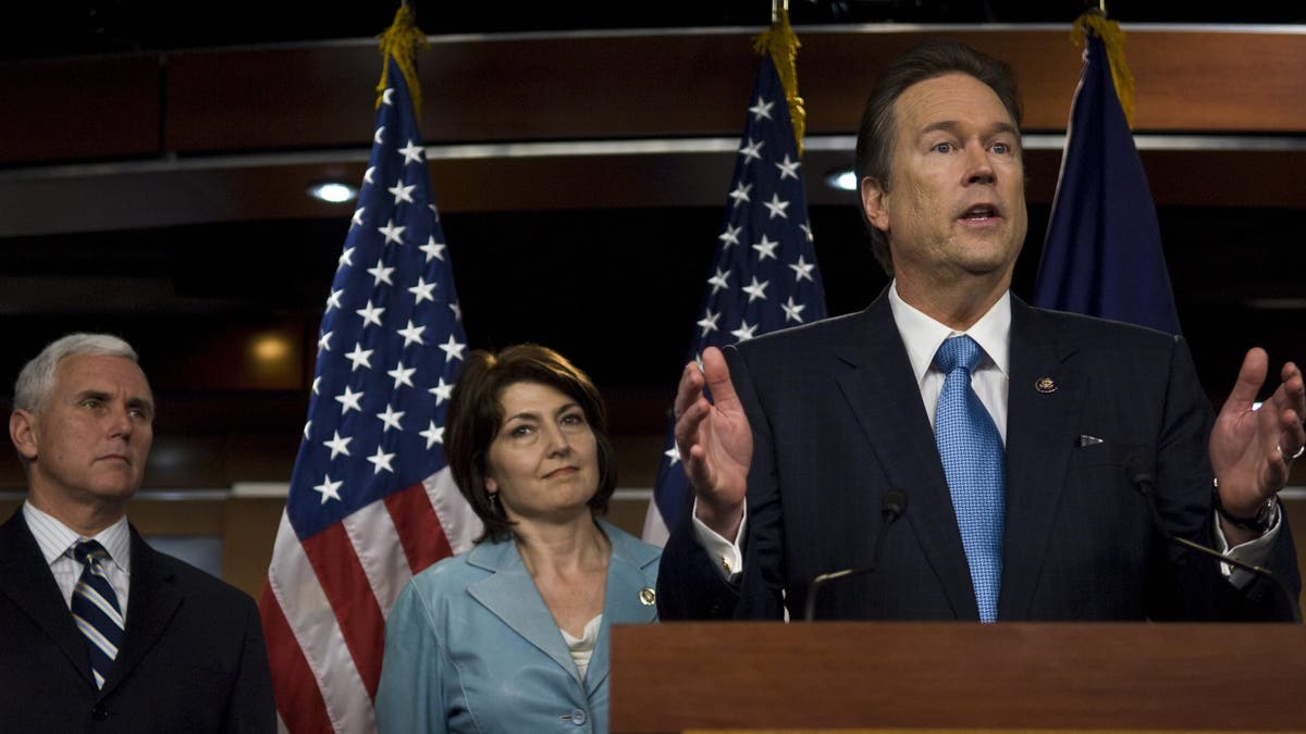 Then-Rep. Mike Pence, R-Ind., listens as Rep. Vern Buchanan, R-Fla., speaks. (Getty)