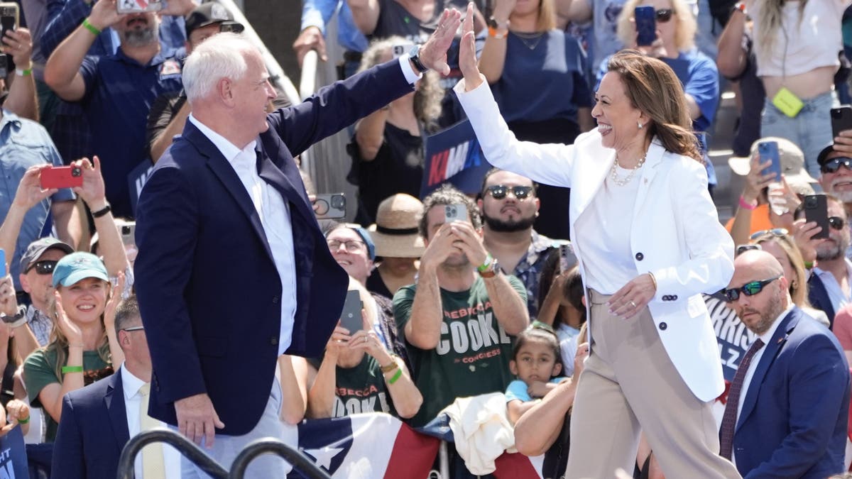 Democratic presidential nominee Vice President Kamala Harris is welcomed by Democratic vice presidential nominee Minnesota Gov. Tim Walz,