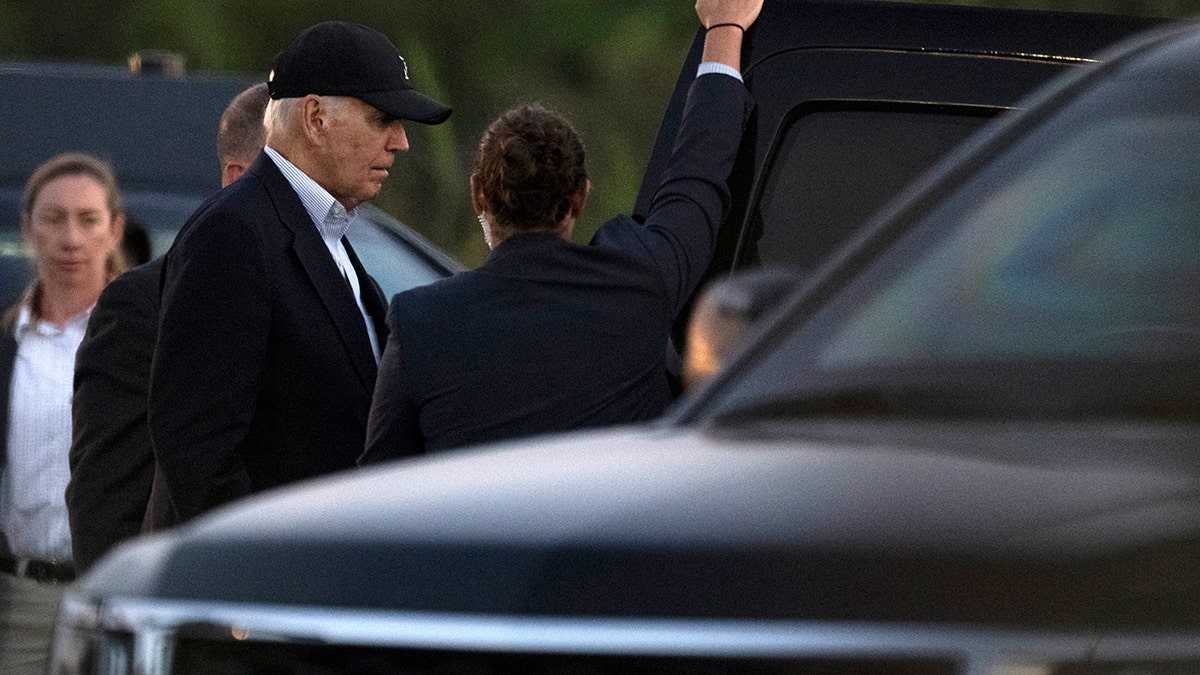 Biden arrives in Delaware and gets into a car