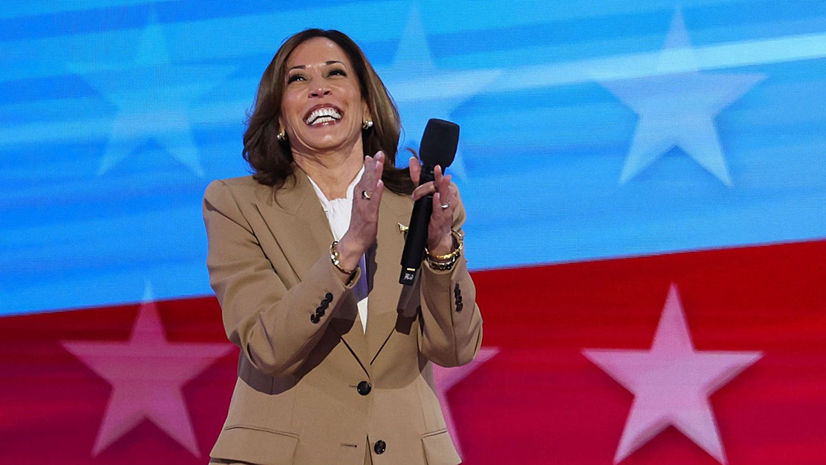 Kamala Harris clapping and smiling