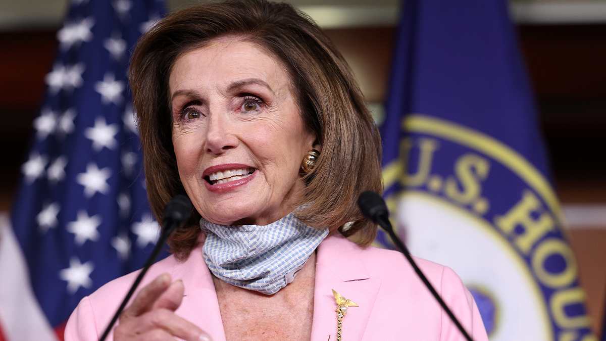 Pelosi speaking at podium