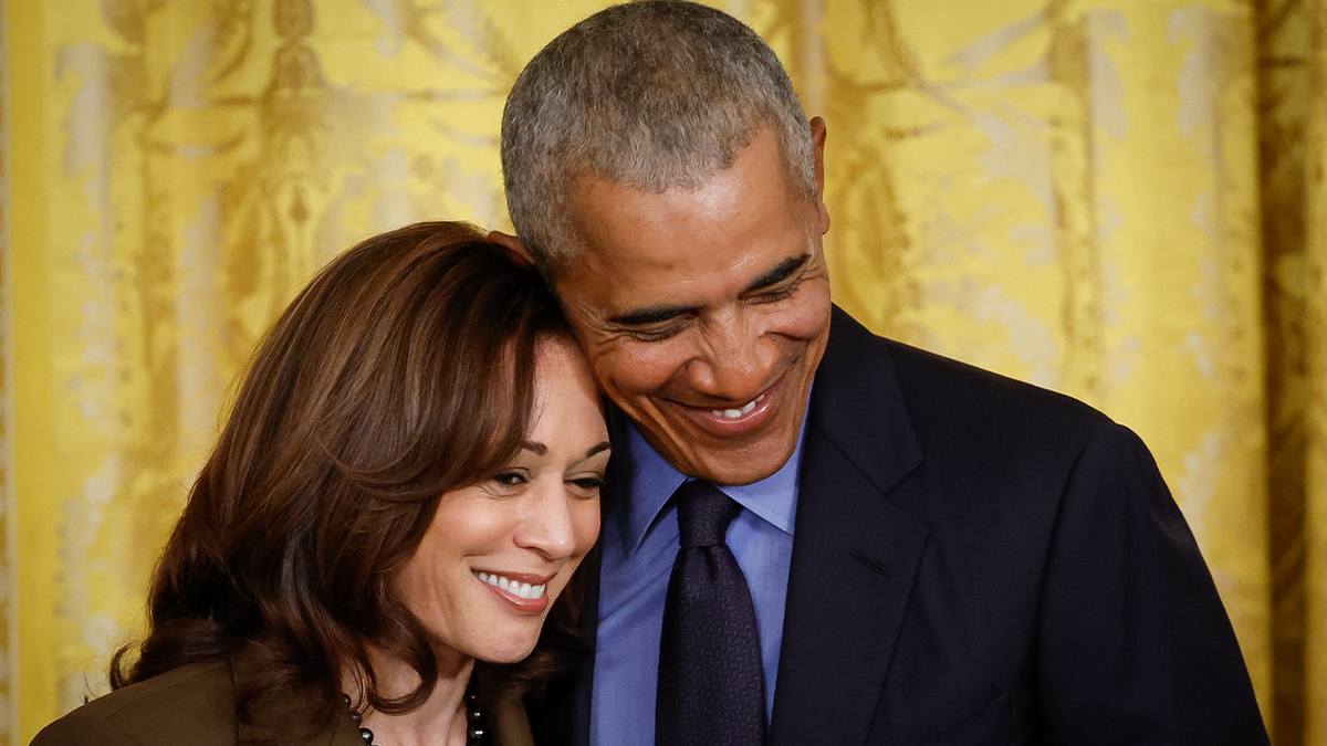 Obama and Harris hug