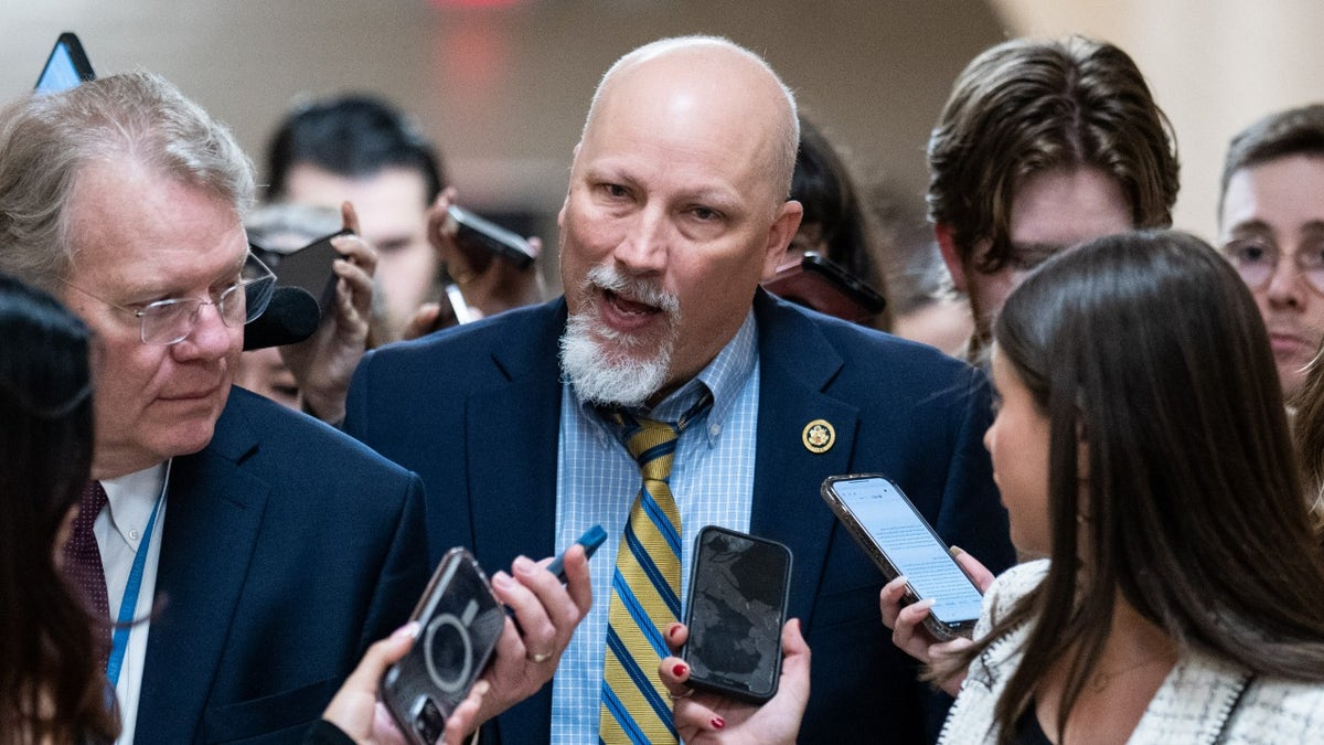 Chip Roy in middle of press gaggle