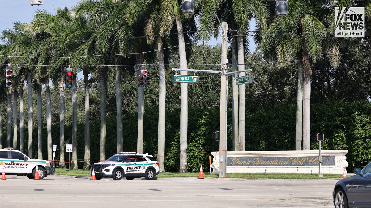 police vehicles block off Trump golf course