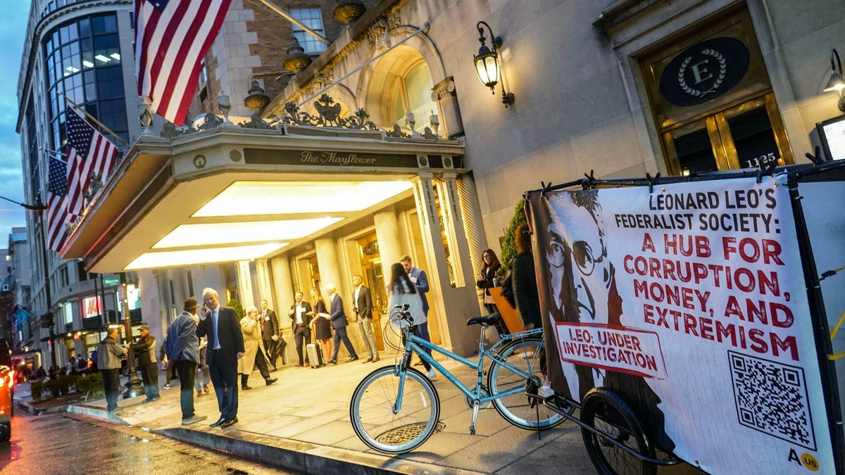 protest sign outside theater