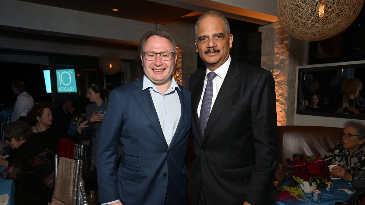 Eric Holder, right, with Alexander Vindman