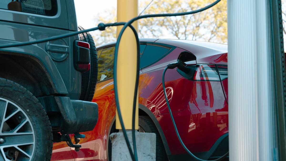 A Tesla charges at an electric vehicle charging station in New York.