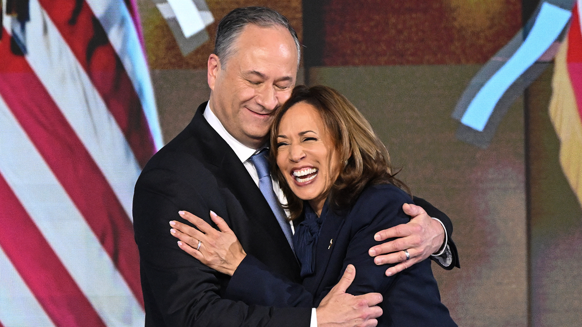 Doug Emhoff hugging wife Kamala Harris