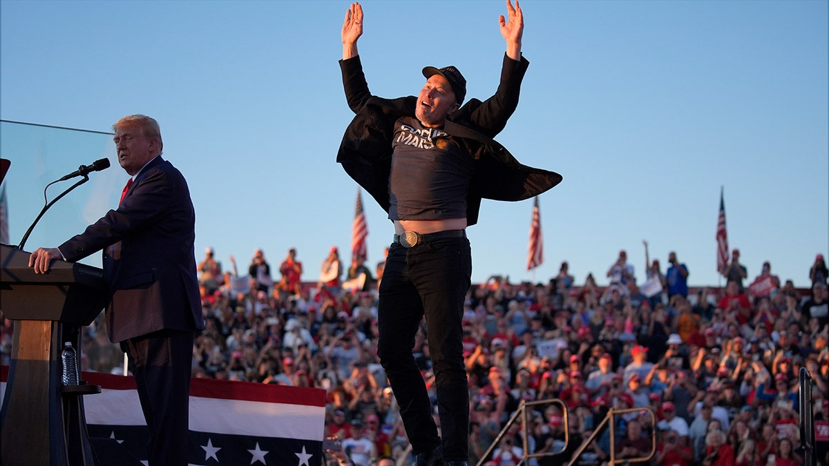 Elon Musk jumping on stage at Trump rally