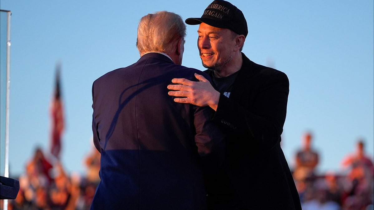 Musk hugging Trump