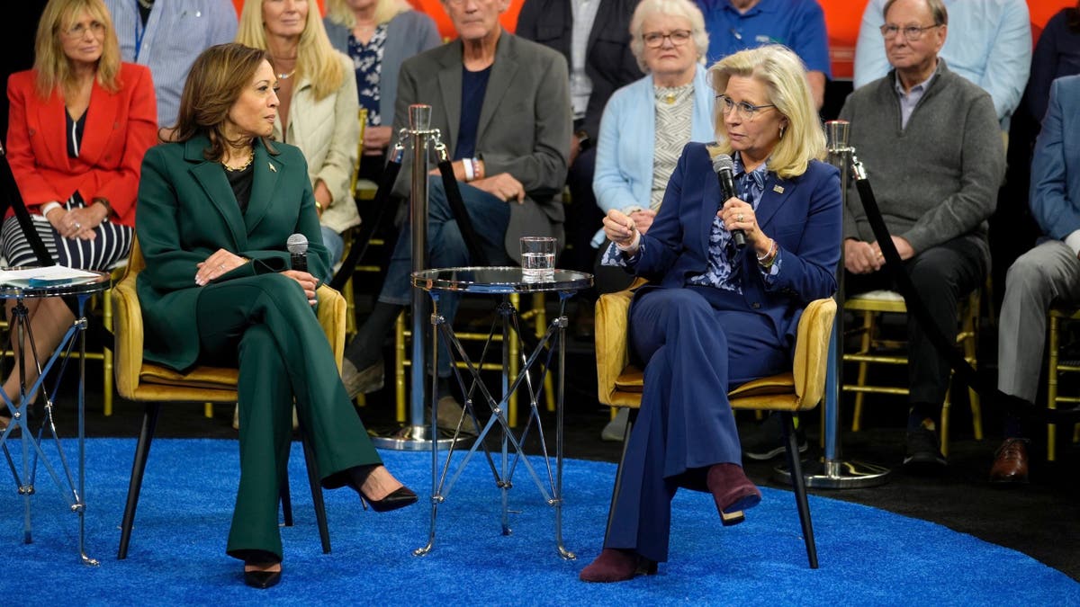 Democratic presidential nominee Vice President Kamala Harris listens as former Republican Rep. Liz Cheney speaks during a Harris campaign town hall in Malvern, Pennsylvania, on Monday, Oct. 21, 2024. (AP Photo/Matt Rourke)