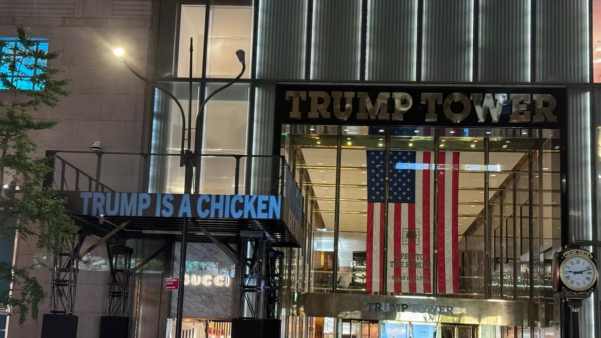 The Democratic National Committee projects images critical of former President Trump on Trump Tower in New York City, on Sept. 30, 2024, on the eve of the vice presidential debate.