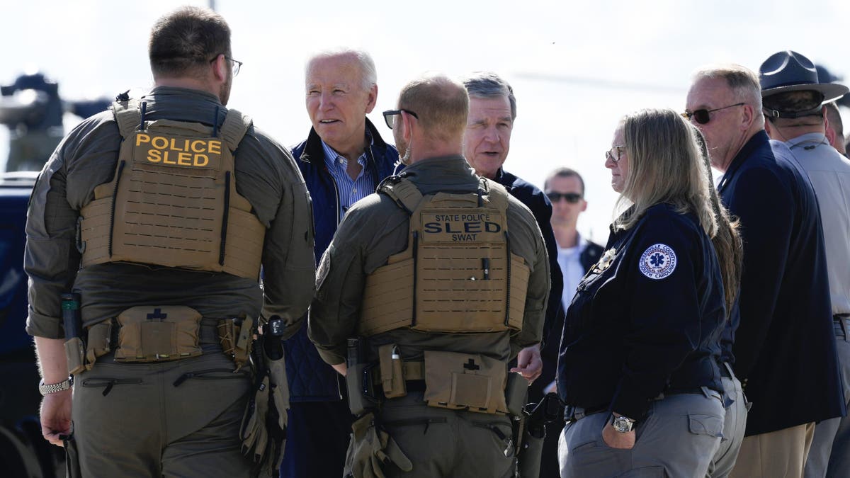 President Biden and Gov. Roy Cooper greet first responders after touring areas impacted by Hurricane Helene, at the ariport in Greenville, South Carolina, Wednesday, Oct. 2, 2024.